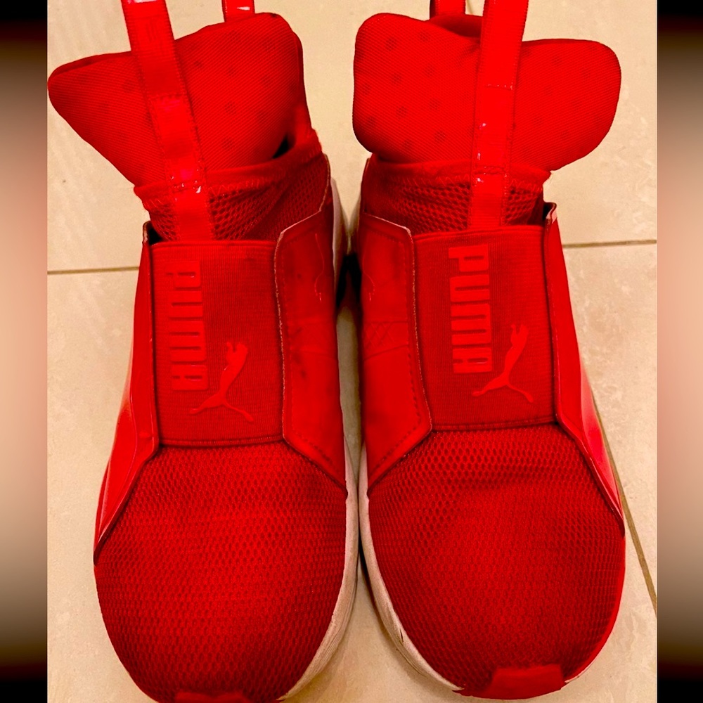 red sneakers by PUMA